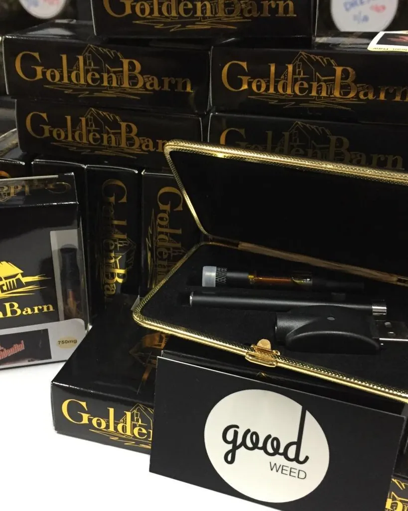 Golden Barn branded packaging and vape hardware alongside Good Weed branding